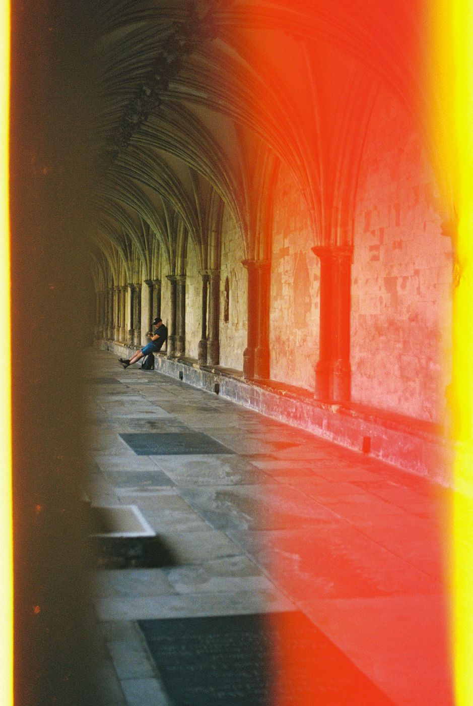 A person in a stone cloister